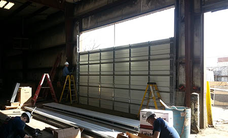 Commercial Door Cut Out from Inside Warehouse